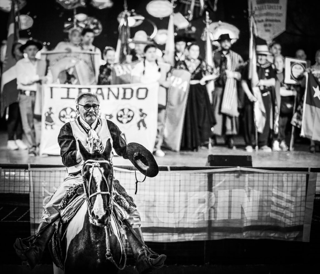 Performer entering public cultural celebration on horseback
