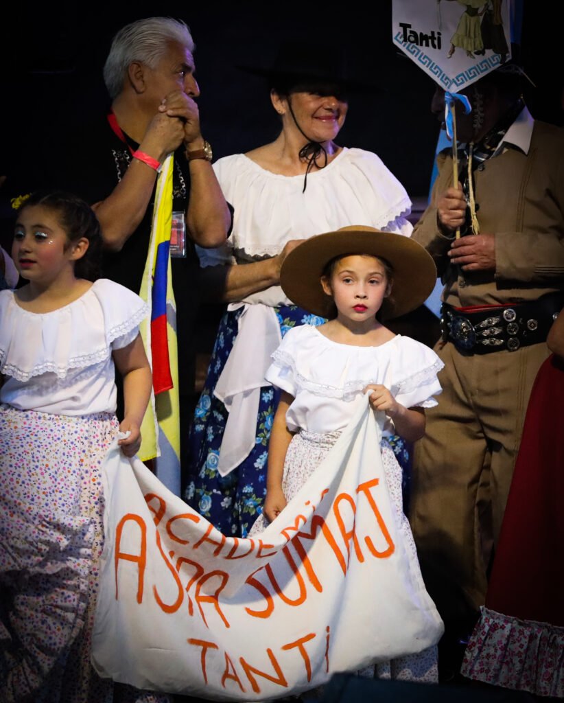Child and older generation during public community celebration
