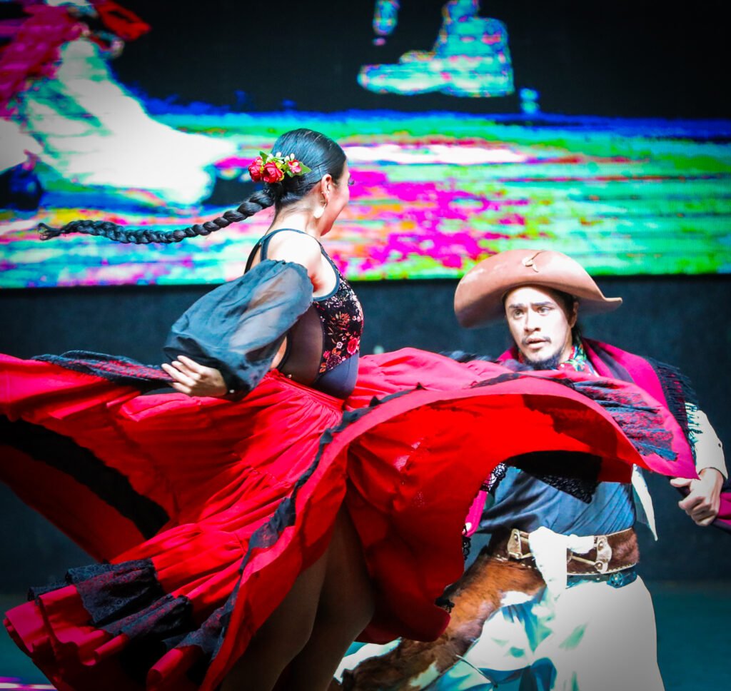 Folk dance captured with expressive fabric motion and stage ligh
