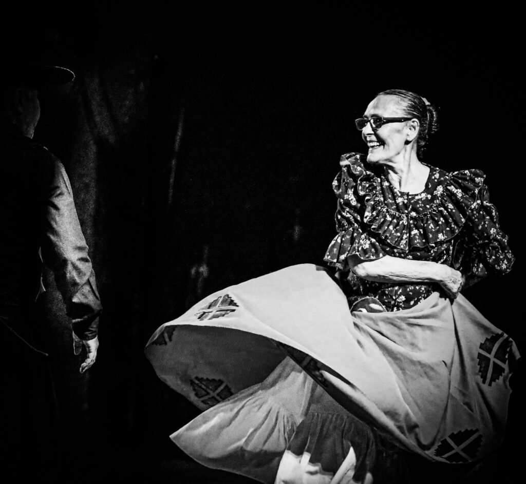 Performer captured in spinning dance movement