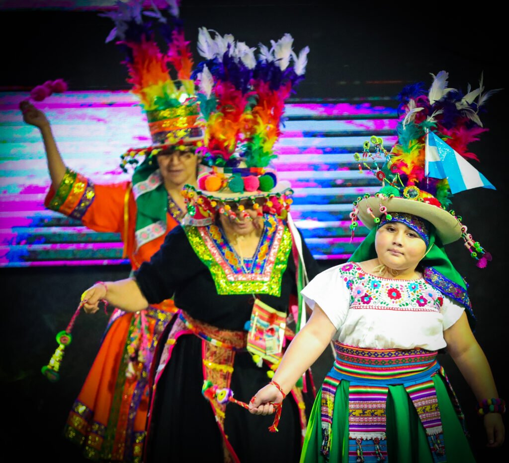 Community festival participants in colorful traditional dress