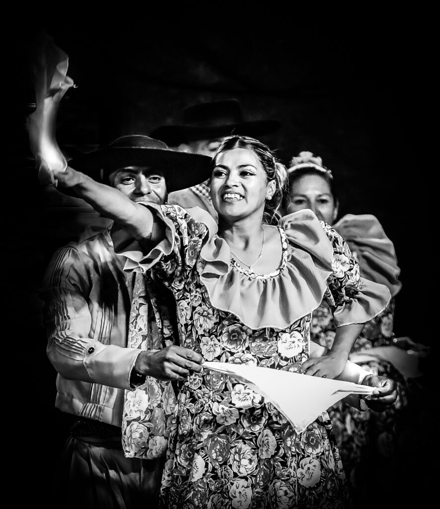 Performer raising hand during public celebration